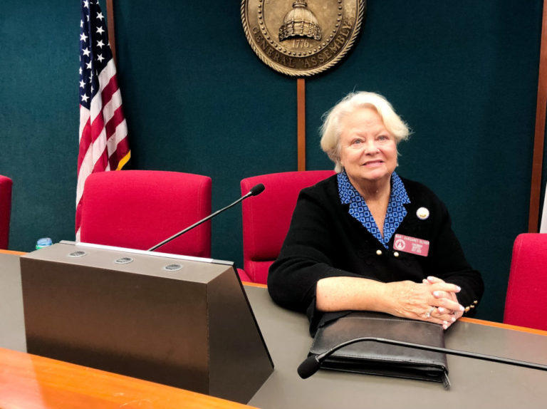 A picture of Representative Mary Margaret Oliver sitting at a desk.