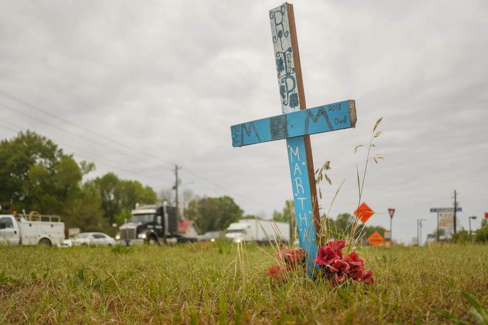 A roadside memorial for a Martha Ard, killed in 2015 at this spot in Macon where three major arterial roads funnel into US 247 South. Four pedestrians have been killed near the spot since 2006.