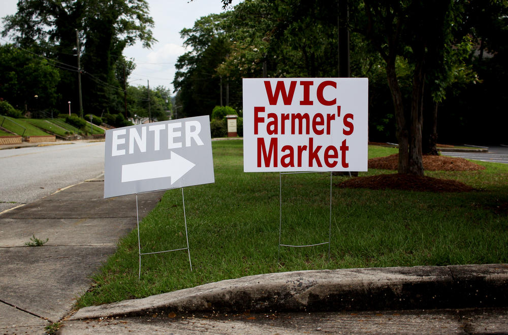 Signage for the WIC Farmers Market in Macon-Bibb County on June 9, 2022. Participants of the federal nutrition supplement program have access to the summer markets, hosted by the Georgia Department of Public Health's 18 districts, through September.
