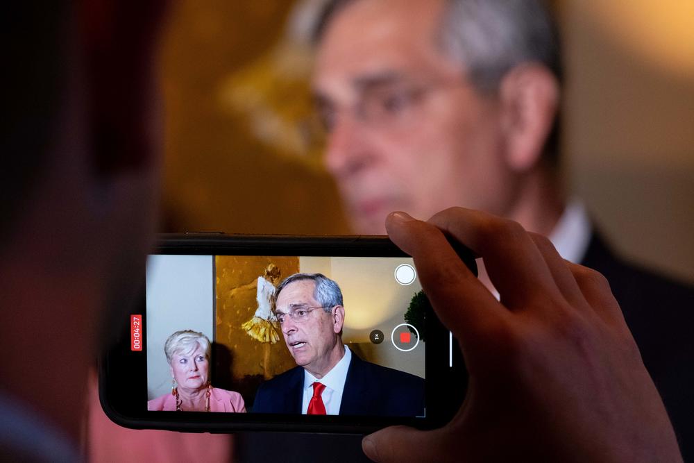 Incumbent Georgia Secretary of State Brad Raffensperger talks with journalists as he arrives for an election night party Tuesday evening, May 24, 2022 in Peachtree Corners, Ga. (AP Photo/Ben Gray)