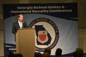  Gov. Brian Kemp announces a series of grants intended to boost school security at a GEMA school safety conference in Columbus.