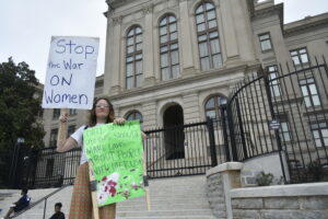 Makayla Splawn takes part in a protest outside the Capitol Tuesday, Protestors said they will switch in and out, forming a constant presence until abortion rights are restored. 