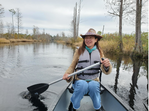 Rena Peck of the Georgia River Network paddles a canoe in the Okefenokee Swamp, which she fears would be harmed by a proposed mine nearby.