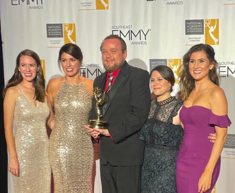 (L to R) Mary Anne Lane, Laura Evans, Jonathan Reedy, Gloria Camacho-Stancliff, and Ashley Mengwasser hold their Emmy award for their work on "Georgia Peanuts Live Exploration"