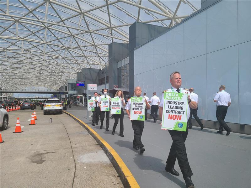 Delta Air Lines pilots picket outside Hartsfield-Jackson Atlanta International Airport's South Terminal on June 30, 2022, as part of a nationwide demand for better pay, scheduling and retirement benefits. (Amanda Andrews / GPB News)