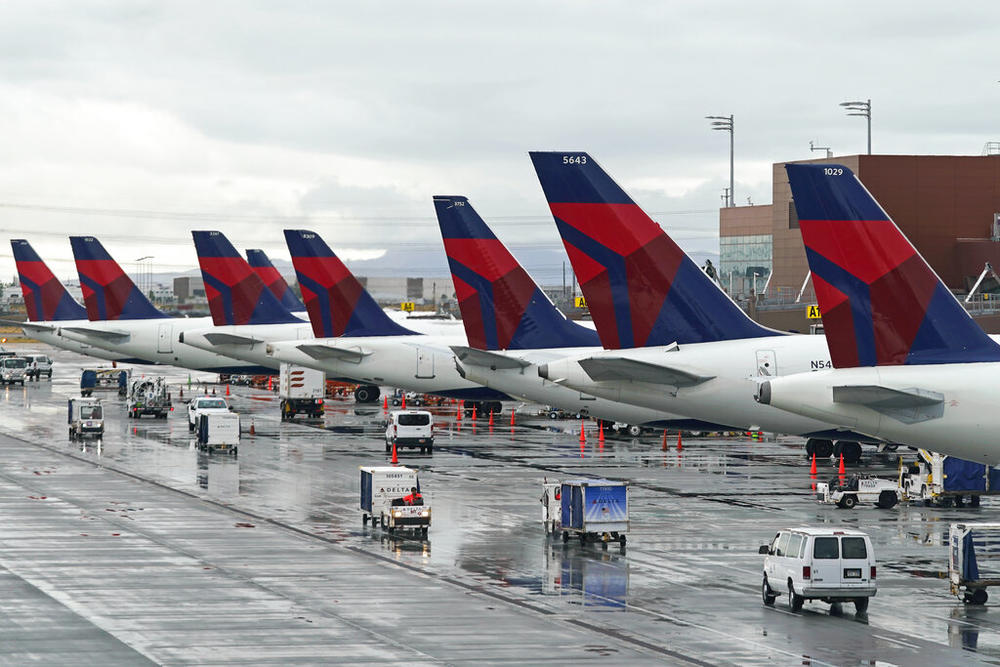 Delta planes sit at their gates on June 13, 2022, at Salt Lake City International Airport, in Salt Lake City. Delta Air Lines has agreed to pay $10.5 million to settle charges it falsified information about deliveries of international mail, including mail sent to U.S. soldiers overseas. The Justice Department said Thursday, June 30, 2022, that Delta was under contract to the Postal Service when it falsified records about deliveries from 2010 to 2016.