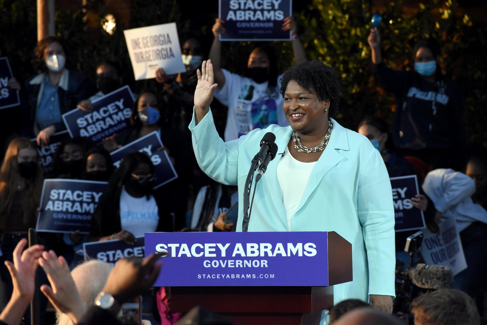 Stacey Abrams waves to a crowd.