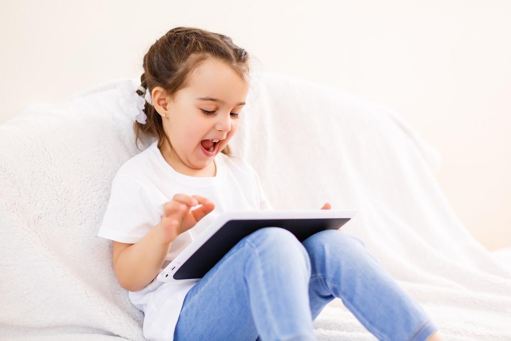 child with tablet