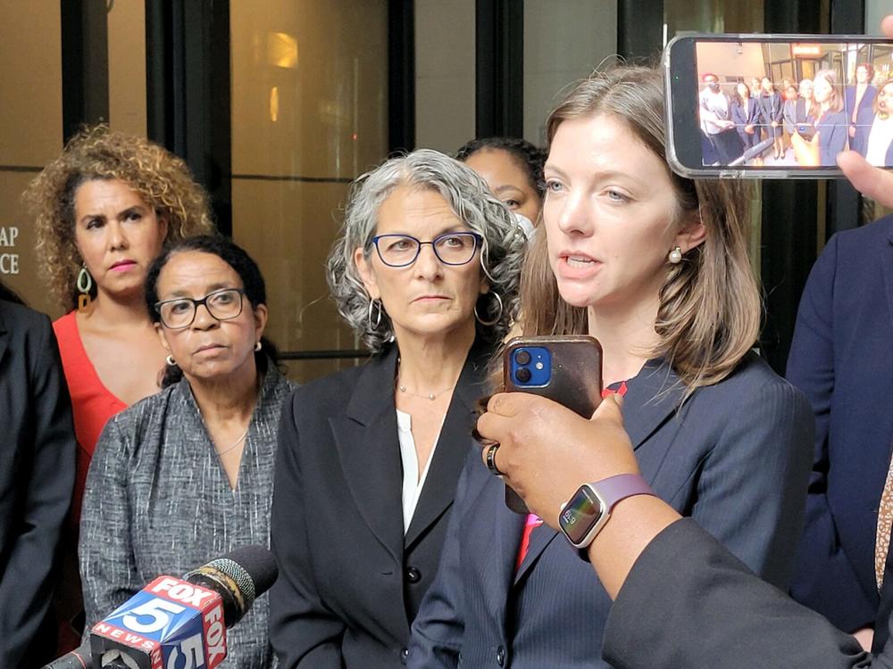 Attorney Julia Stone speaks with reporters outside the Lewis R. Slaton Courthouse in Atlanta. Stone was one of the attorneys who presented arguments Monday in a case that could put a hold on Georgia’s six-week abortion ban. 
