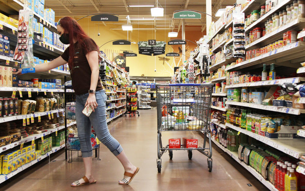 Julia Adele Callahan reaches for a box of pasta at a grocery store in Macon, Georgia, on August 15, 2022. Callahan and her two kids get WIC benefits every month that help pay for essential foods, like baby formula, whole grains, dairy and protein.