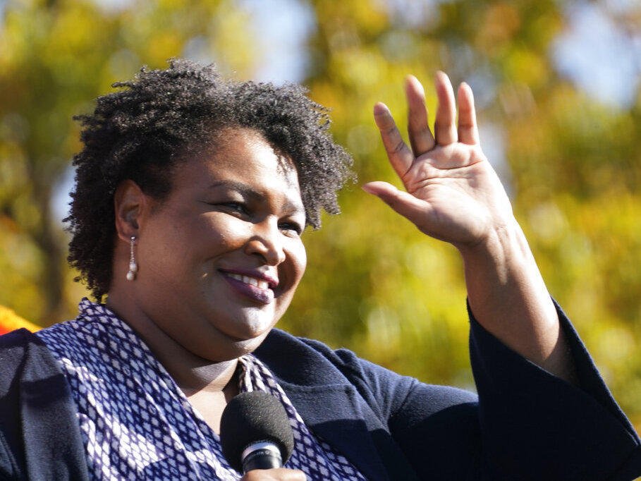 Stacey Abrams speaks to Biden supporters as they wait for former President Barack Obama to arrive and speak at a rally as he campaigns for Democratic presidential candidate former Vice President Joe Biden, Monday, Nov. 2, 2020, at Turner Field in Atlanta.