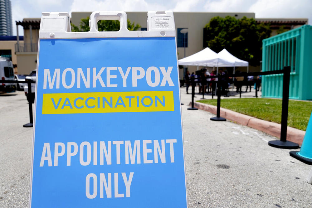 A sign for monkeypox vaccinations is shown at a vaccination site, Wednesday, Aug. 10, 2022, in Miami Beach, Fla. Miami-Dade County, in partnership with Nomi Health, will begin offering monkeypox vaccinations to eligible, high-risk residents on Friday. U.S. health officials on Tuesday authorized a plan to stretch the nation's limited supply of monkeypox vaccine by giving people just one-fifth the usual dose, citing research suggesting that the reduced amount is about as effective. (AP Photo/Lynne Sladky)