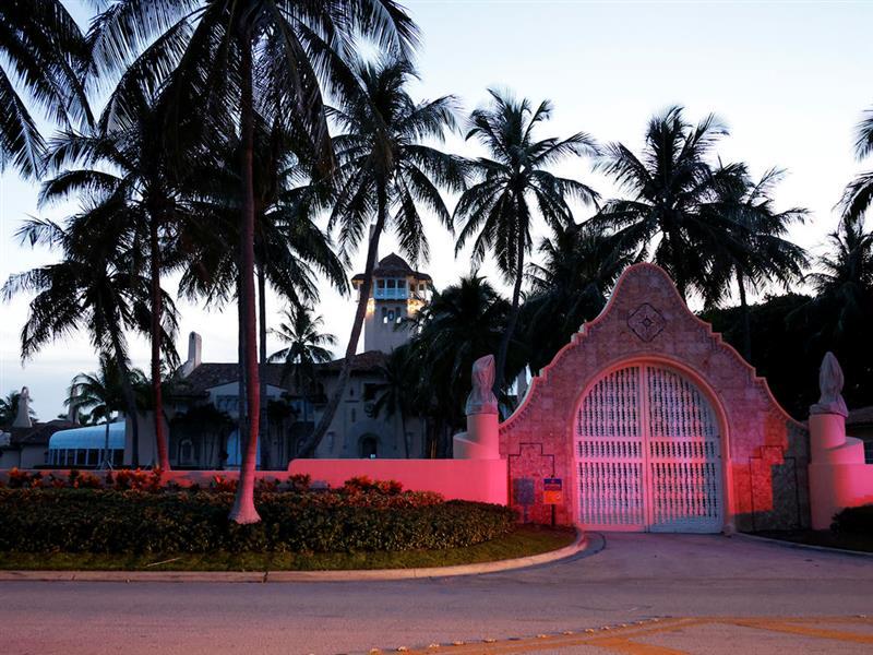 The entrance to former President Donald Trump's Mar-a-Lago estate is shown, Monday, Aug. 8, 2022, in Palm Beach, Fla. Trump said in a lengthy statement that the FBI was conducting a search of his Mar-a-Lago estate and asserted that agents had broken open a safe. (AP Photo/Terry Renna)