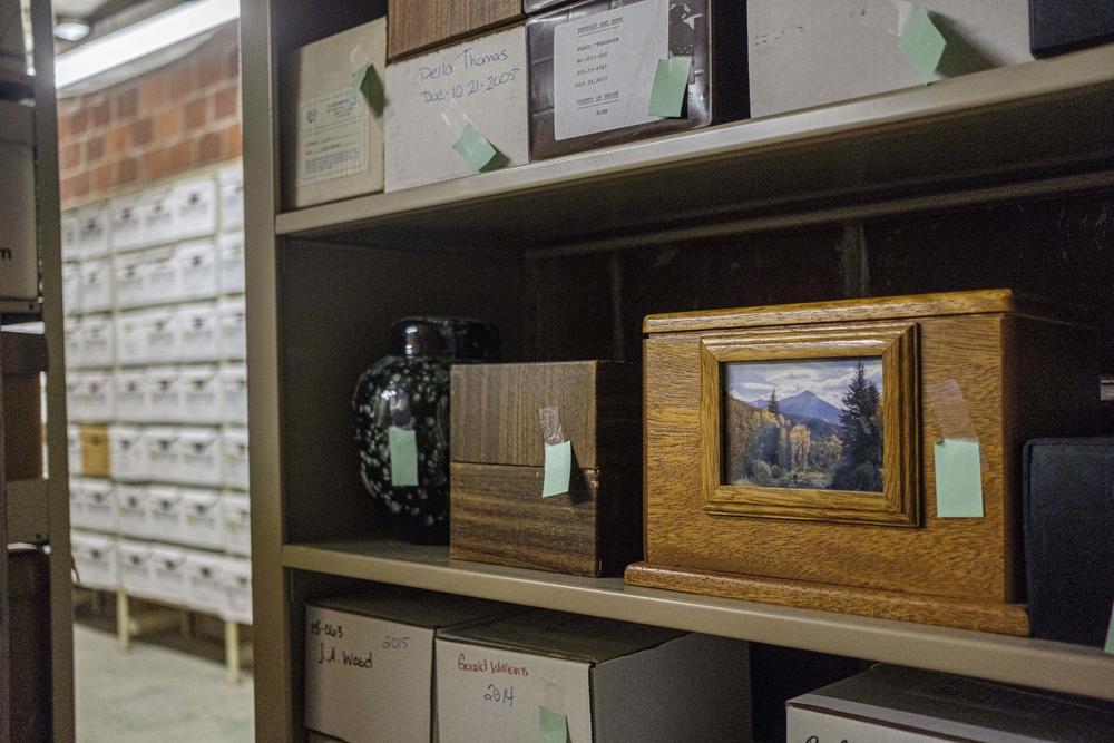 Boxes of human ashes, or cremains, on shelves of the the Macon-Bibb County archive. 