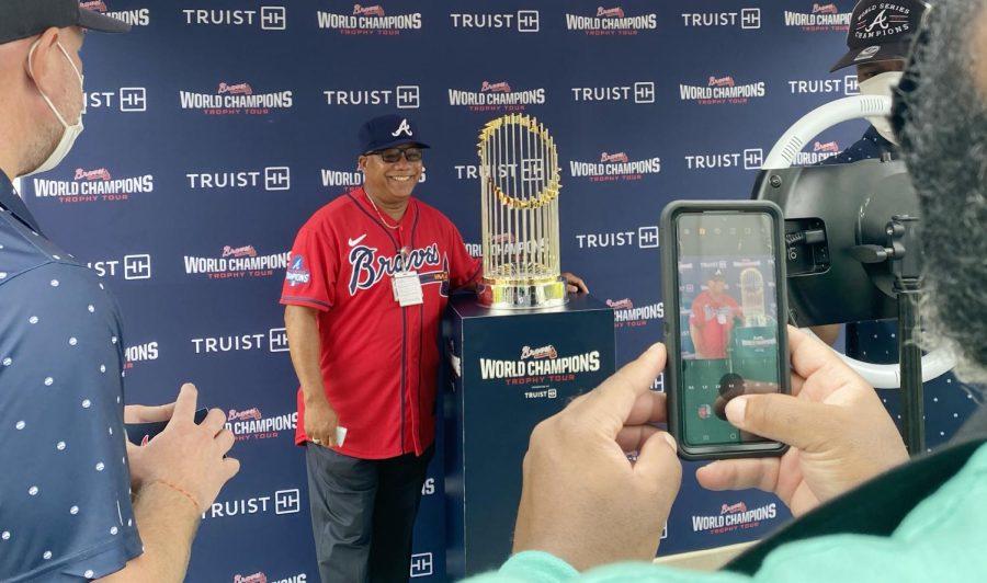 John Rawls, Sr. poses with the Braves World Series Commissioner’s Trophy in downtown Macon, Ga. “It means the world to me,” Rawls said. 