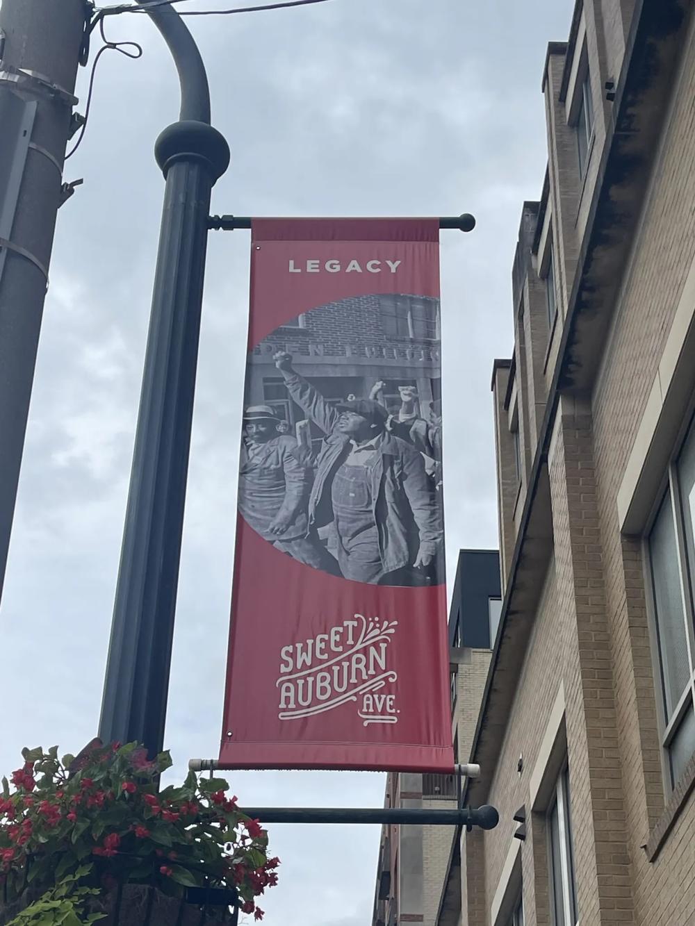 Legacy signage hangs from a street pole on Auburn Avenue in 2022