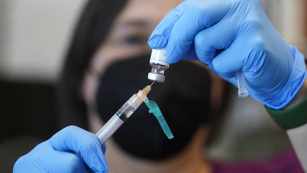 A registered nurse prepares a dose of a Monkeypox vaccine at the Salt Lake County Health Department Thursday, July 28, 2022, in Salt Lake City. U.S. health officials on Tuesday, Aug. 9, 2022, authorized a new monkeypox vaccination strategy designed to stretch limited supplies by allowing health professionals to vaccinate up to five people — instead of one — with each vial.