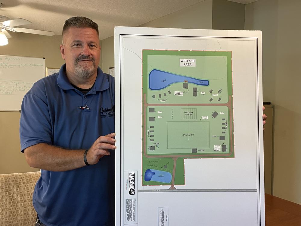 Randy Nichols holds plans for a sober living community