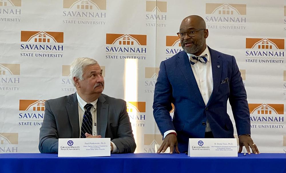 Grand Valley State University vice president B. Donta Truss (right) speaks alongside Grand Valley State engineering dean Paul Plotkowski.