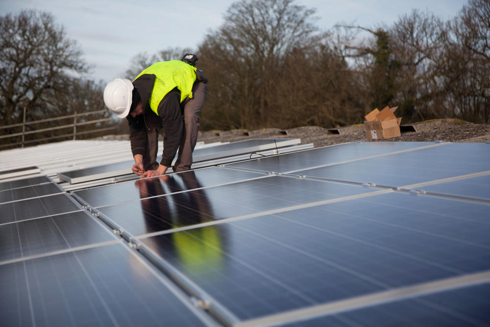 Solar panels being installed on roof