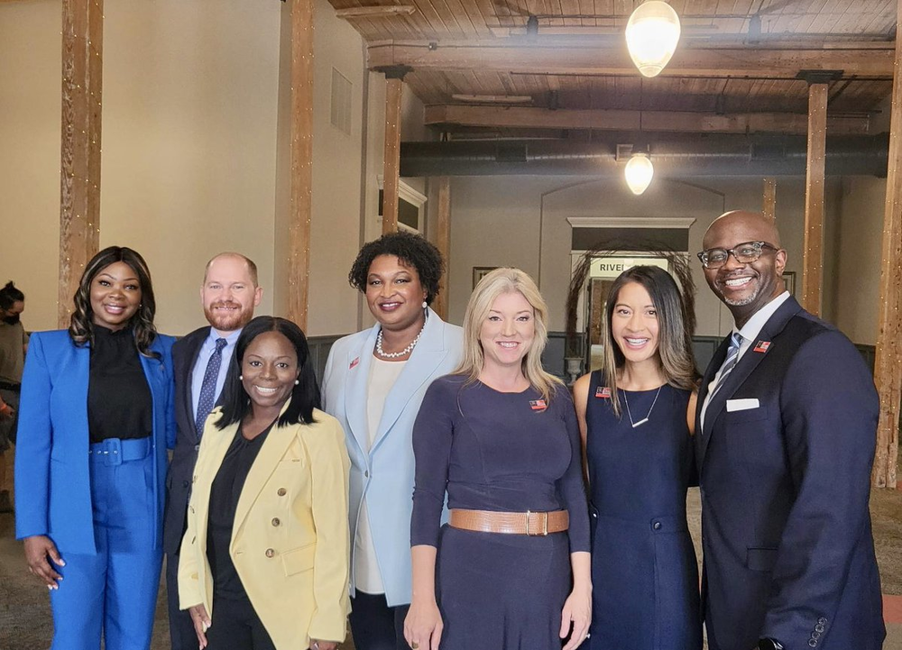 The 2022 Democratic ticket in Georgia includes nominee for governor Stacey Abrams (center), state Sen. Jen Jordan (third from right), who's running for attorney general; state Rep. Bee Nguyen (second from right), nominee for secretary of state; and other candidates pictured at the Georgia Democratic state convention Aug. 27, 2022. (Twitter)