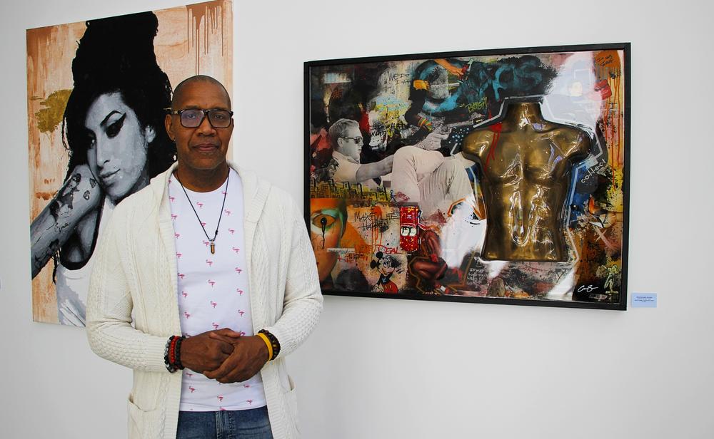 Anderson Smith stands beside his piece "Steve McQueen Shot Me"