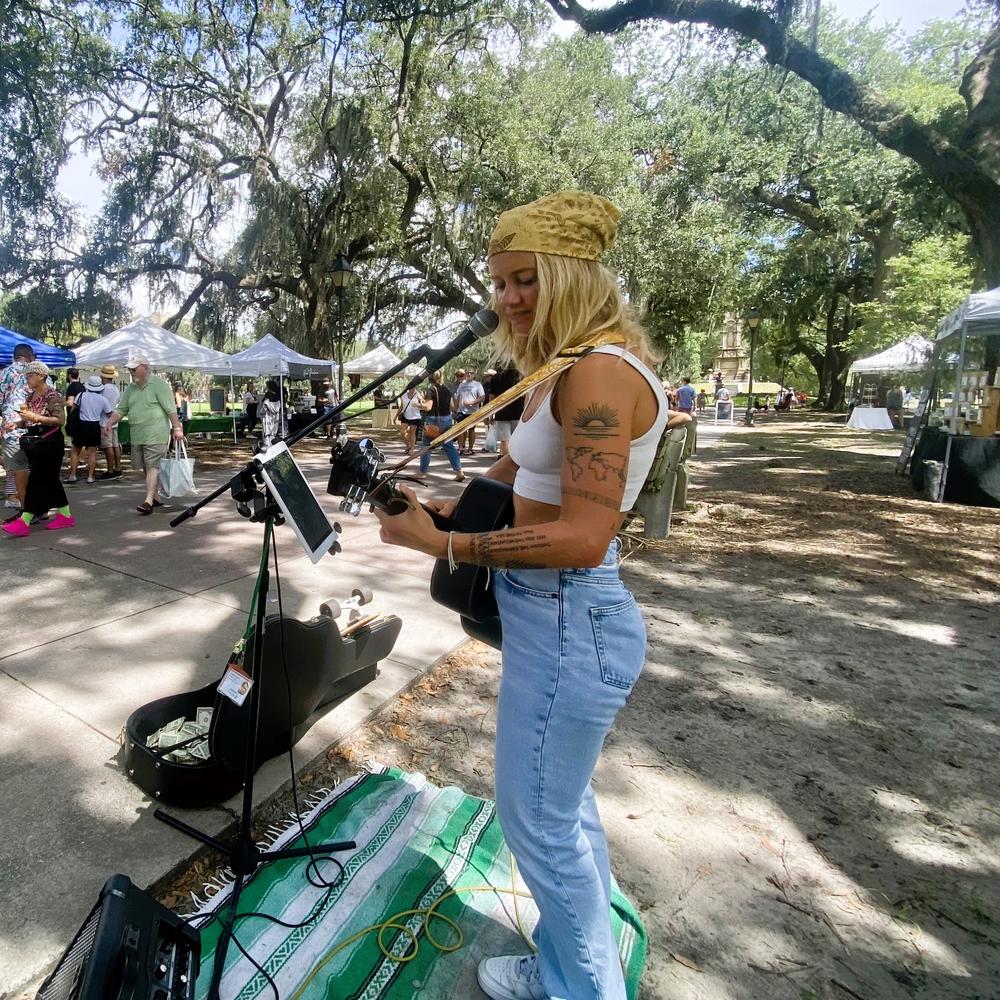 Clara Waidley busking at the Forsyth Farmers' Market in Savannah