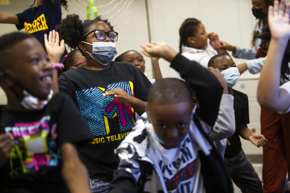 Students take part in a dance break in their classroom at Beecher Hills Elementary School on Friday, Aug. 19, 2022, in Atlanta. Mounting evidence shows that students who took part in remote learning during the coronavirus pandemic lost about half of an academic year of learning.