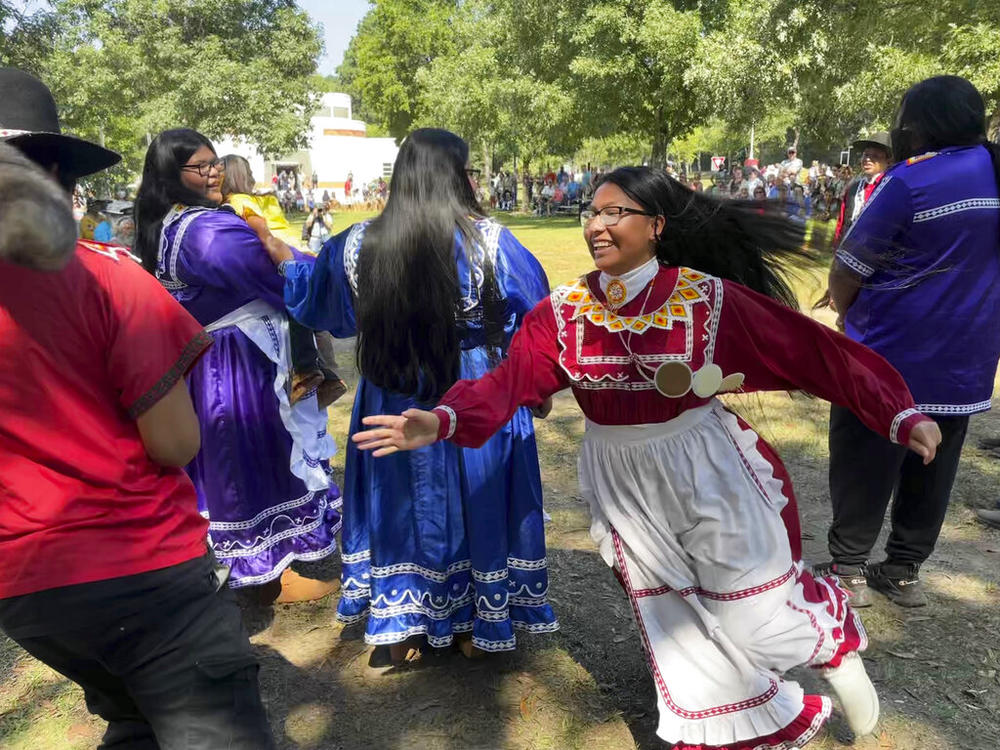 Isley Phillips, 18, chases her brother Noah, 19, and his racoon-tail hat as part of their traditional Racoon Dance, on Saturday, Sept. 17, 2022, in Macon, Ga. The teenagers are members of the Mississippi Band of Choctaw Indians, and performed at the 30th annual Ocmulgee Indigenous Celebration at the Ocmulgee Mounds.