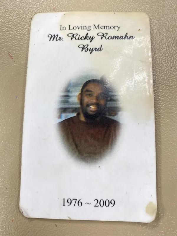  Maggie Mainor carries around a card with her memorializing her brother, Ricky Byrd, whose murder in 2009 in east Savannah remains unsolved. Jake Shore/The Current