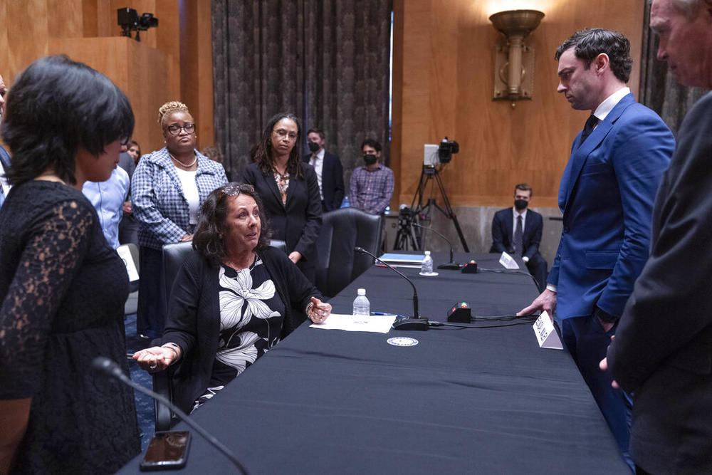 Belinda Maley, center, mother of Matthew Loflin, who died in the Chatham County Detention Center in Georgia, speaks to subcommittee chair Sen. Jon Ossoff, D-Ga., and ranking member Sen. Ron Johnson, R-Wis., next to Vanessa Fano, sister of Jonathan Fano, who died in the East Baton Rouge Parish Prison in Louisiana, far left, and Andrea Armstrong, Professor of Law at Loyola University New Orleans College of Law, at right, after the three testified to a Senate Homeland Security and Governmental Affairs Subcommi