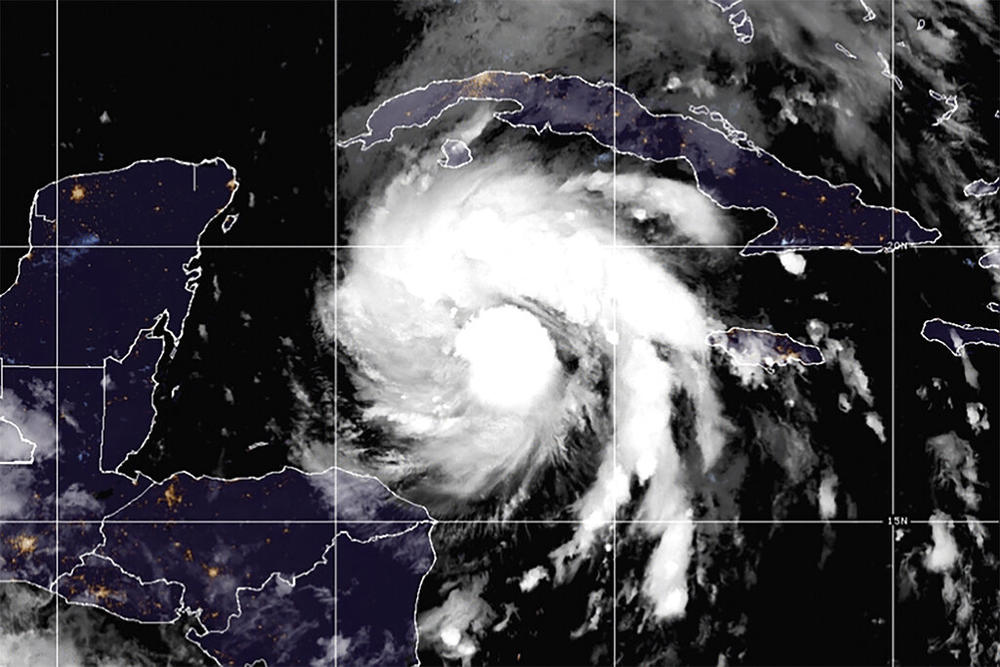 This satellite image provided by the National Oceanic and Atmospheric Administration shows Tropical Storm Ian over the central Caribbean on Monday, Sept. 26, 2022.