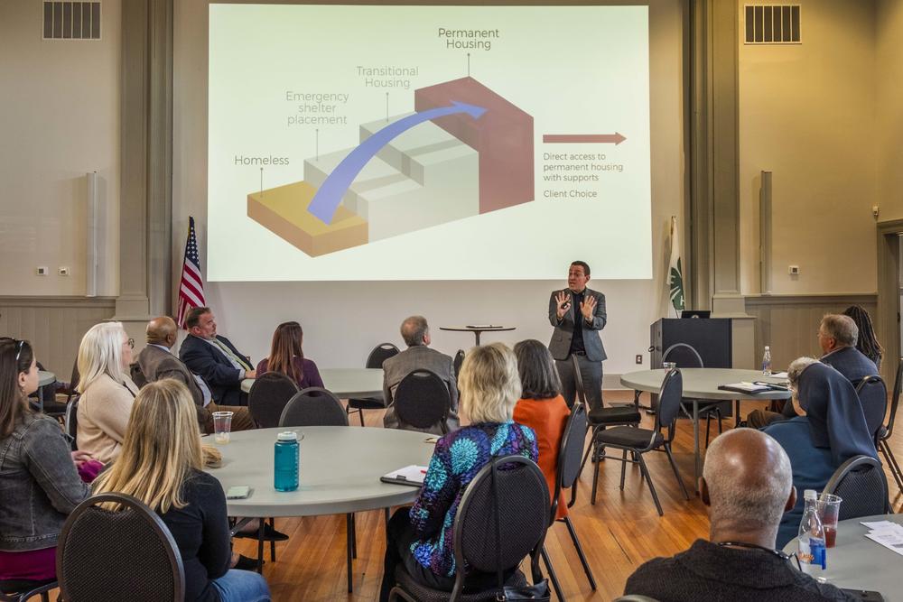 Consultant and advocate for the homeless Andrae Bailey explains the concept of "Housing First" to non-profit leaders in Macon recently.