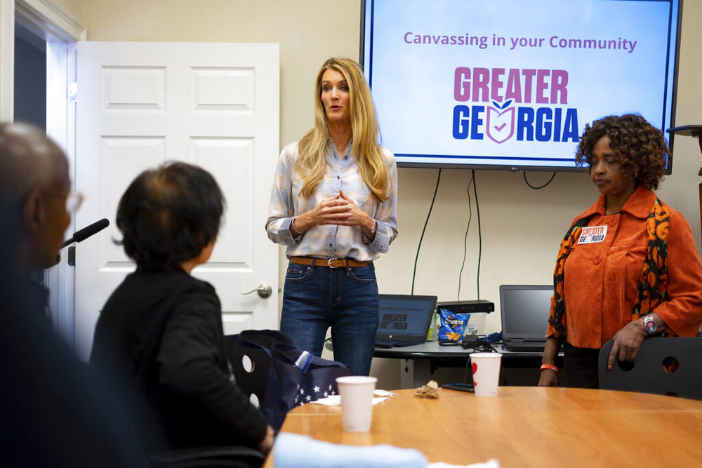 Former Sen. Kelly Loeffler, R-Ga., speaks to volunteers before a Greater Georgia voter registration canvassing effort, Saturday, Oct. 8, 2022, in Marietta, Ga. (AP Photo/Ben Gray)