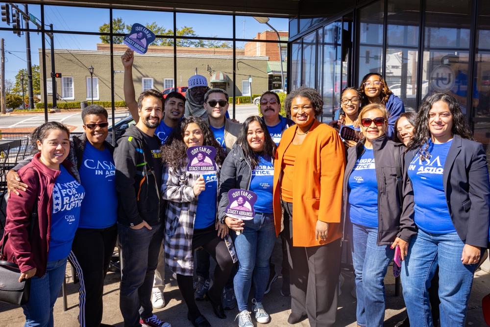 Lin-Manuel Miranda and Stacey Abrams meet with volunteers in Lawrenceville, Ga. on Oct. 19, 2022