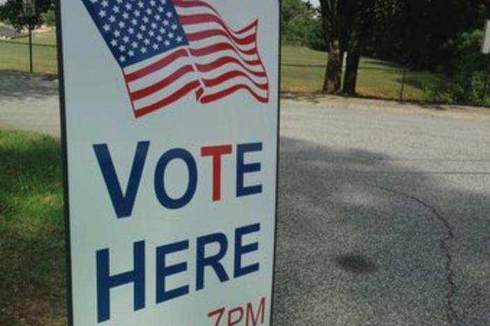 A Georgia polling location displays voting hours on sign outside of precinct.