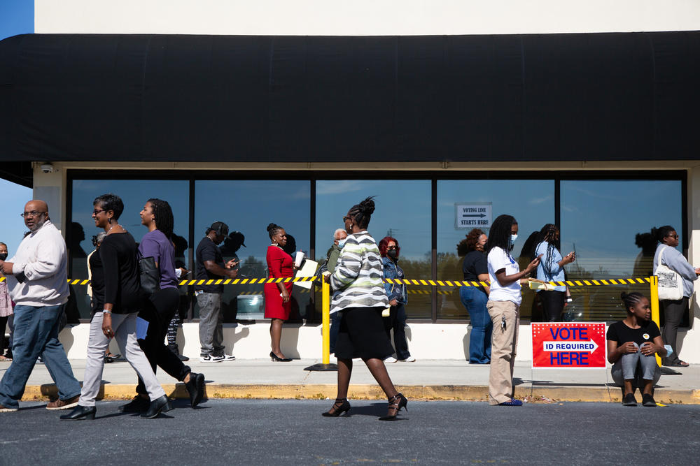 Voters take advantage of weekend voting Oct. 23 in Macon. But the runoff election currently lacks early Saturday voting.