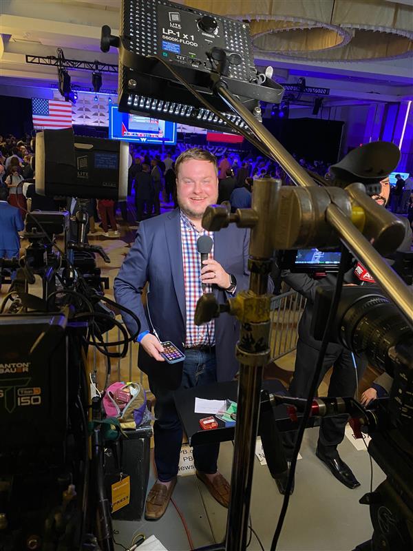 GPB News' Stephen Fowler covers an event for Sen. Raphael Warnock at the Marriott Marquis in downtown Atlanta on election night.