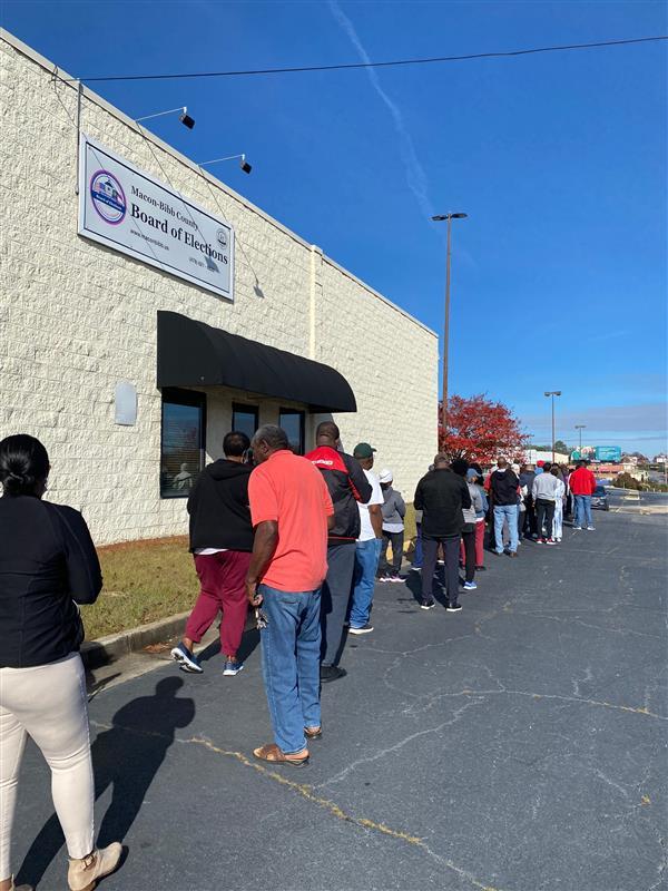 Voters in Bibb County wait in line to cast their runoff election ballots on Nov. 26, 2022.