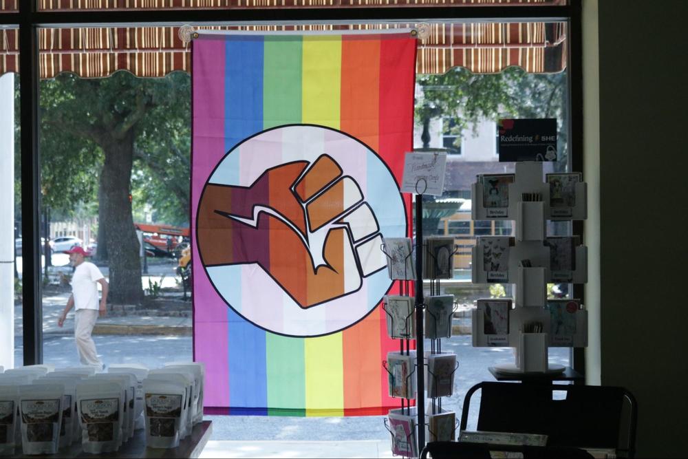 The Pride flag sits prominently in the window of the Bohemian Den on Cherry Street in Macon. The Bohemian Den is owned by Macon Pride President Scott Mitchell, who helps put together the events for Macon Pride Week.