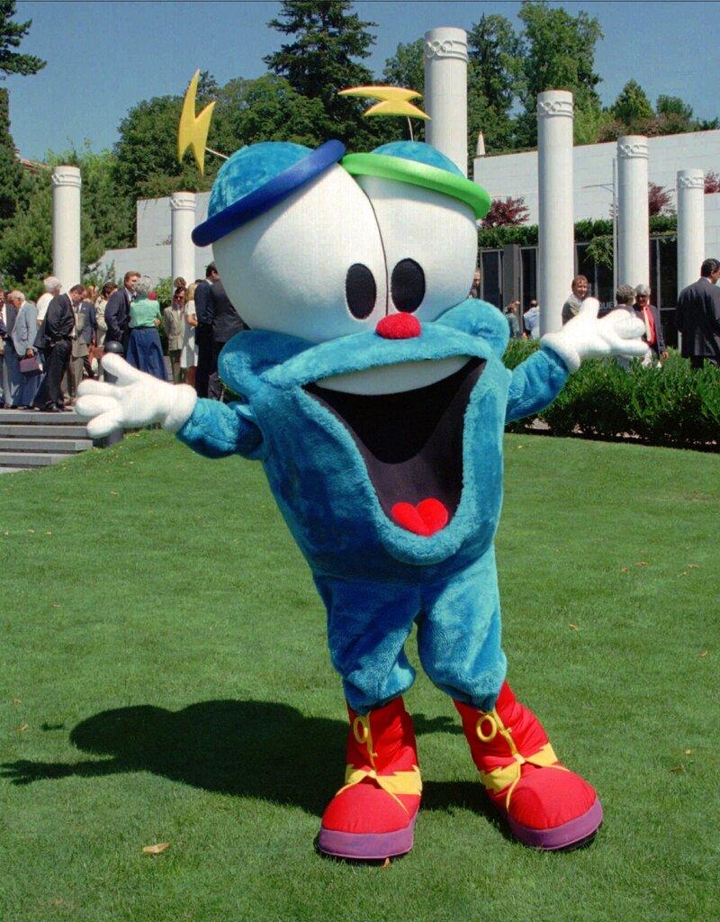 In this July 19, 1995, file photo, Izzy, the mascot of the Olympic Games of Atlanta 1996, dances in front of the Olympic Museum in Lausanne, Switzerland. The much-hated blob that represented the 1996 Atlanta Games has been supplanted by the mascot for the Paris Olympics — a Phrygian cap.