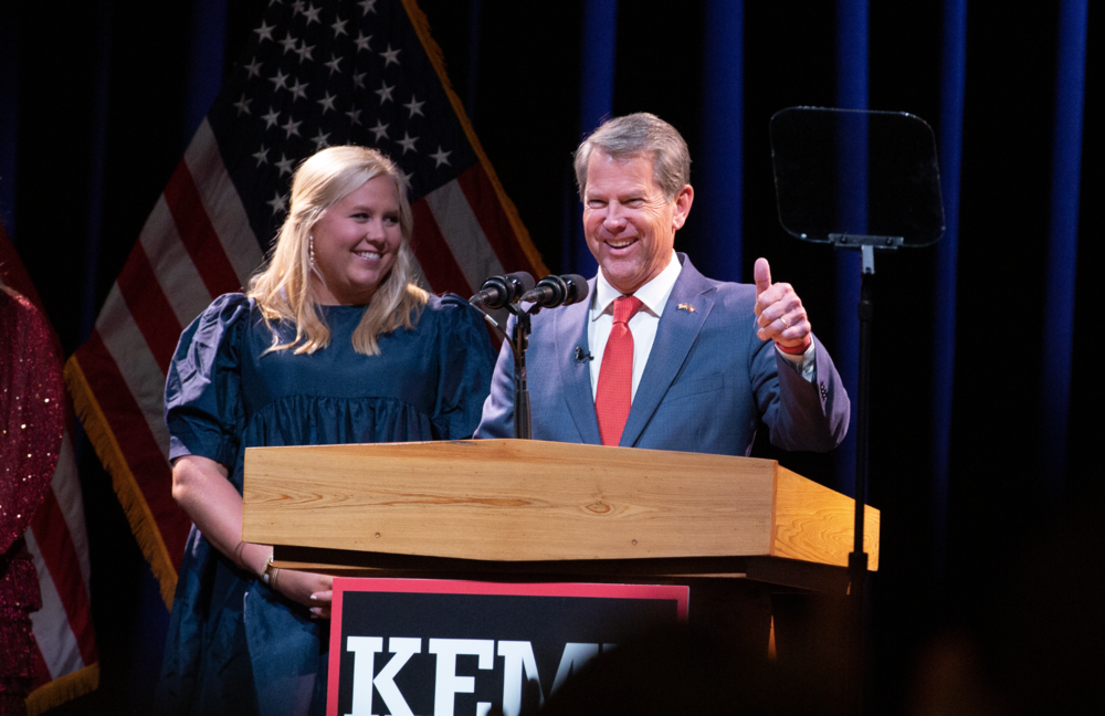 Gov. Brian Kemp gives a thumbs-up sign in celebration of his reelection win over Stacey Abrams late Nov. 8, 2022.