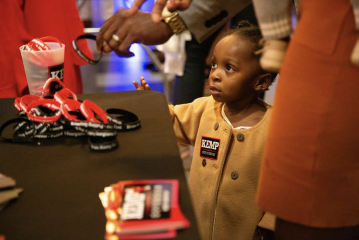 A child at a Brian Kemp event on Nov. 8, 2022