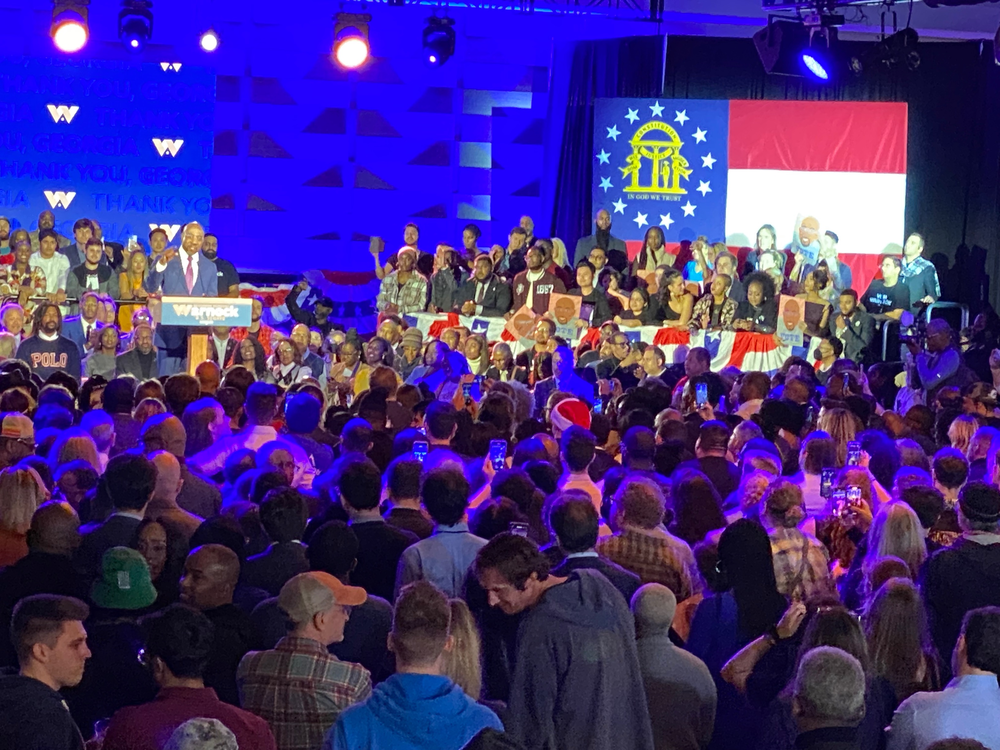 U.S. Sen. Raphael Warnock gives a victory speech after winning reelection over Republican challenger Herschel Walker in a Dec. 6, 2022, runoff campaign.