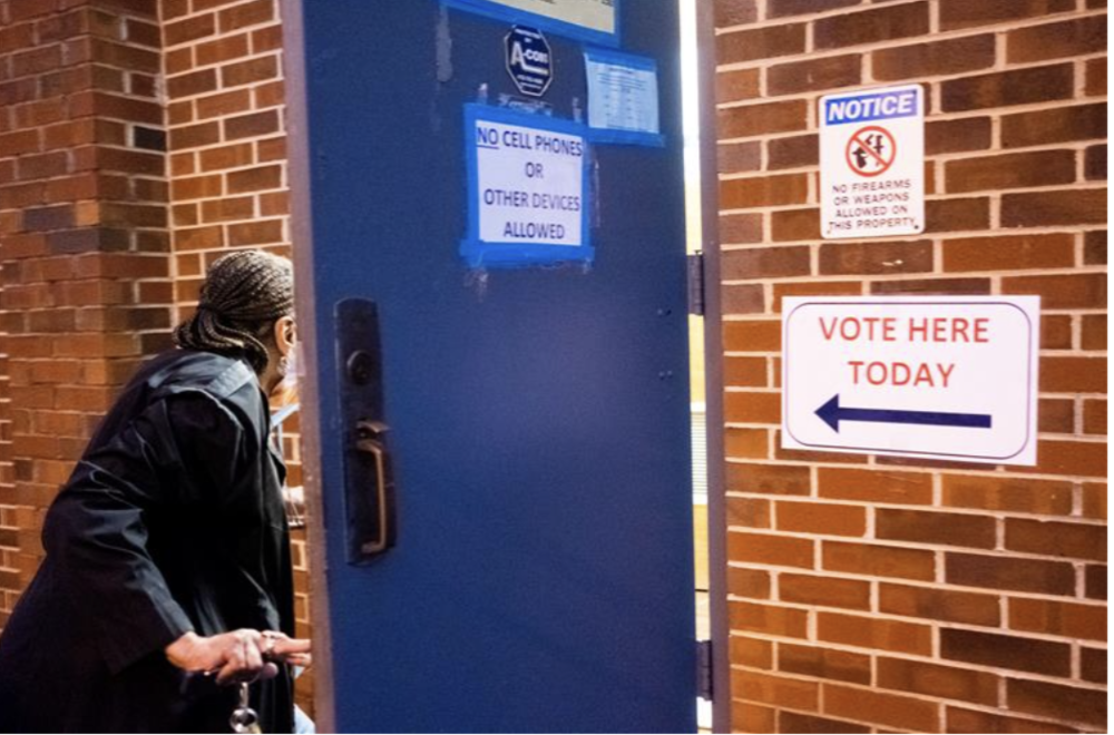 A voter enters Glorious Hope Baptist Church on Dec. 6, 2022