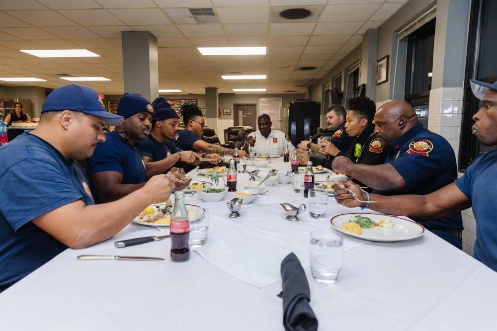 Firefighters enjoy a meal from Chops Lobster Bar in Atlanta.
