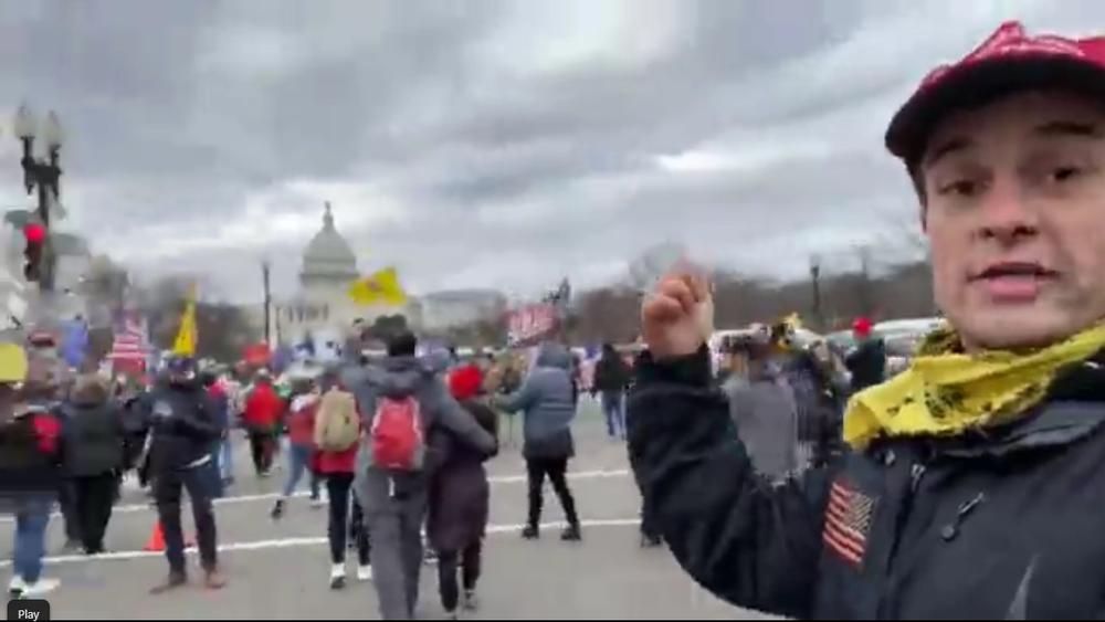During the march to the U.S. Capitol, Dominic Box appears onscreen as he narrates a video livestreamed through the Savannah Freedom Alliance Facebook group. 