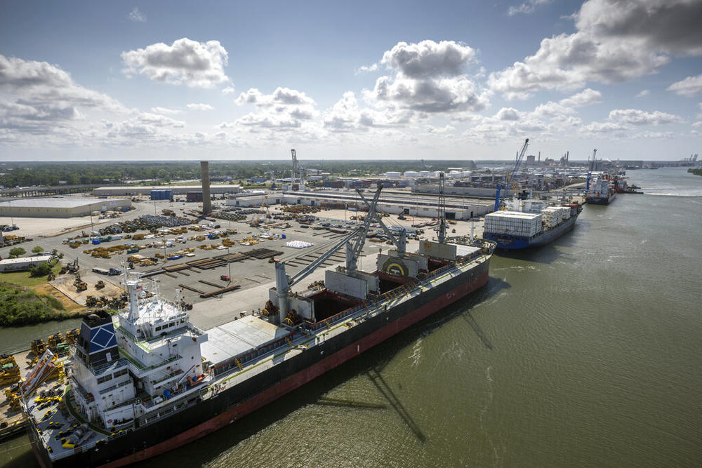 In this photo provided by the Georgia Ports Authority, three vessels work to load and unload cargo at the Georgia Ports Authority Ocean Terminal, June 24, 2022 in Savannah, Ga. On Monday, Dec. 5, 2022 the Georgia Ports Authority announced it will start remodeling the docks at Ocean Terminal in January 2023 to handle two large container ships simultaneously. The work will begin to transition the 200-acre facility to a container-only operation.