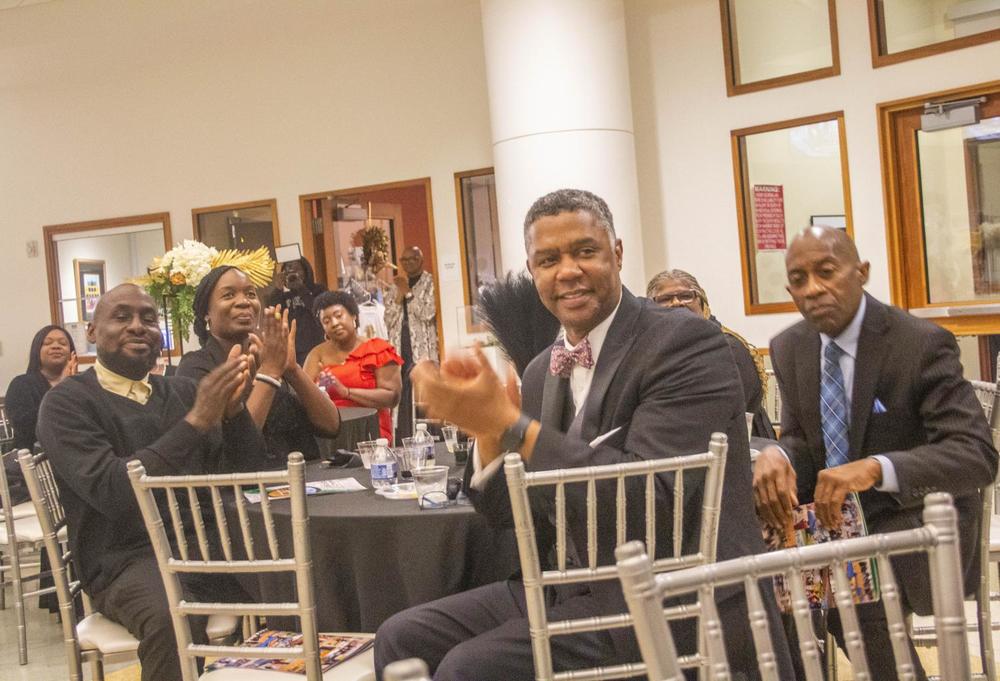 Rep. James Beverly, D-Macon, applauds a speaker at the black-tie fundraising gala for the Macon-Bibb Community Enhancement Authority in the rotunda of the Tubman African American Museum on Oct. 29, 2022. (Laura Corley | The Macon Newsroom)