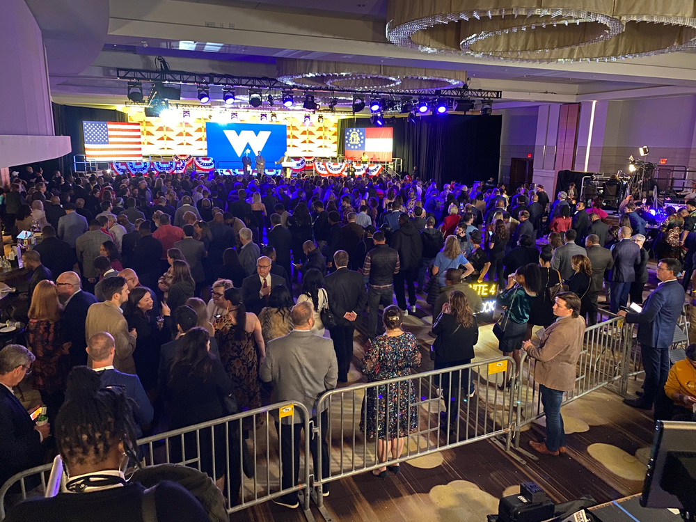 Supporters at Raphael Warnock's campaign event on Dec. 6, 2022